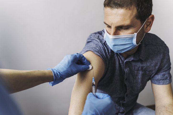 MAN GETS VACCINATED
