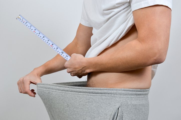 MAN WITH A MEASURING TAPE