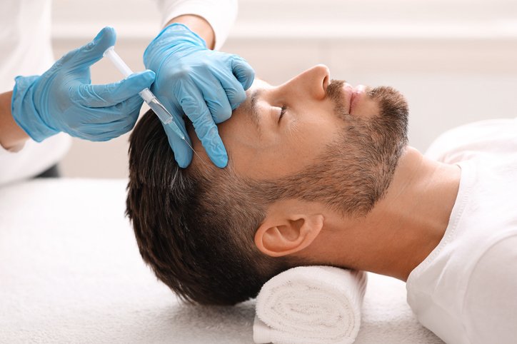 MAN HAVING HAIR TREATMENT