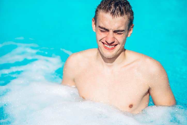 MAN IN SWIMMING POOL
