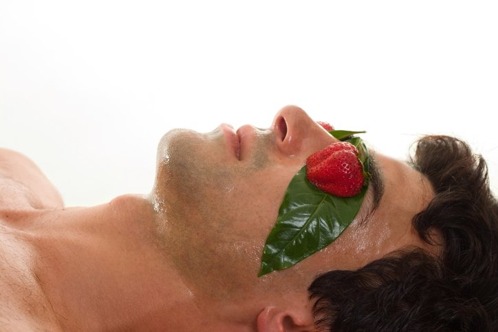 MAN WITH MOISTURIZING MASK ON HIS FACE
