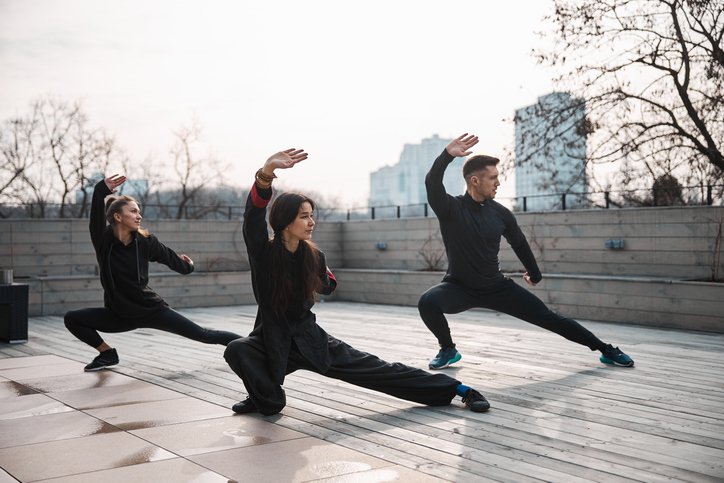 THREE PEOPLE DOING TAI CHI